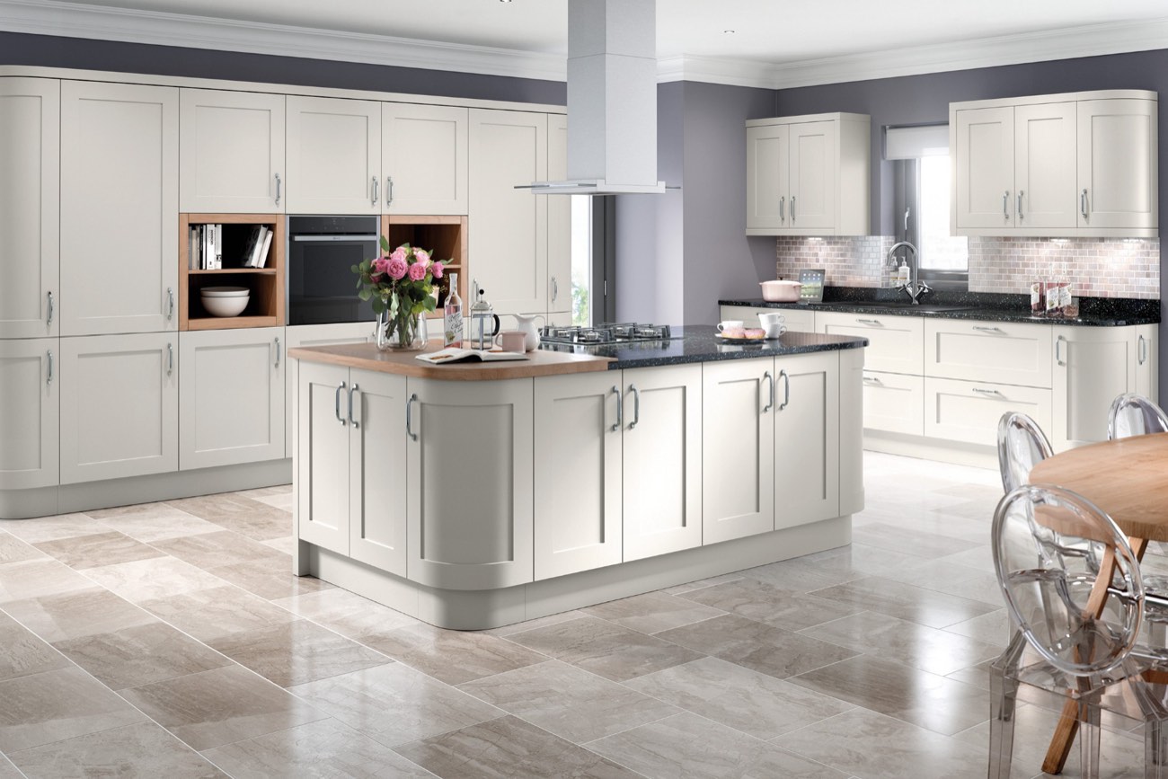 An Oxford shaker kitchen in light grey, with an island and a stone worktop