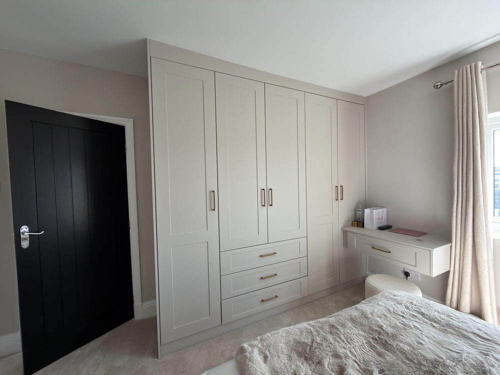 Fitted bedroom wardrobes in cream shaker