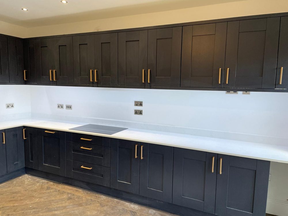 Navy shaker kitchen with brass handles
